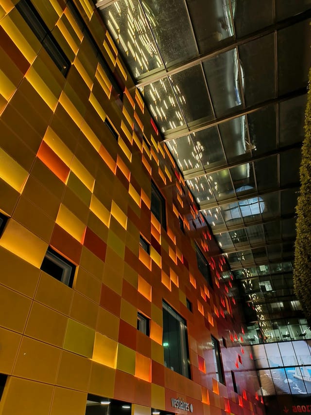 Vibrant Studio 221 venue with illuminated panels for networking and creative events.