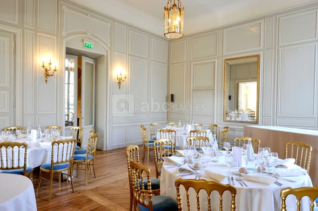 Sophisticated restaurant event space with elegant tables, ideal for upscale meetings and banquets.