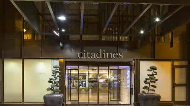 Modern Citadines Les Halles Paris entrance with sleek glass, perfect for events.