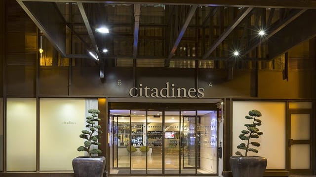 Modern Citadines Les Halles Paris entrance with sleek glass, perfect for events.