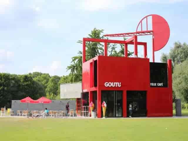 Vibrant red café in Parc de la Villette for outdoor meetings and events.