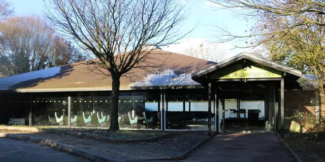 Modern conference center with large windows in Parc Floral de Paris for events and meetings.