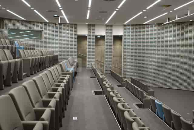 Modern auditorium with tiered seating in Grande Arche for conferences and events.
