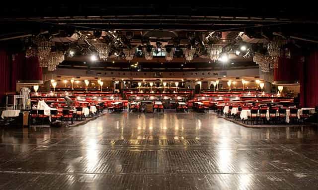 Elegant auditorium in Théâtre du Lido, polished wooden floor, perfect for banquets and conferences.