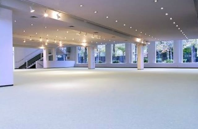 Spacious meeting room with large windows for corporate events and social gatherings.