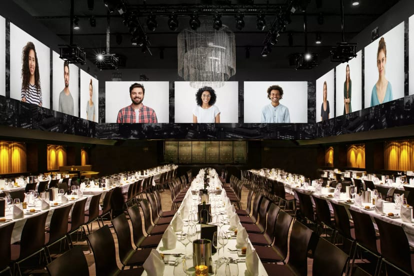 Modern event space in Zurich with elegant table setup for hybrid formal dinners.