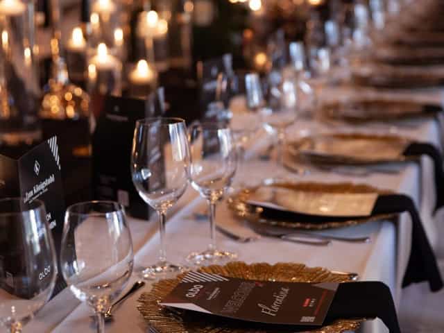 Elegant dining table with gold accents for a formal gala or networking event.