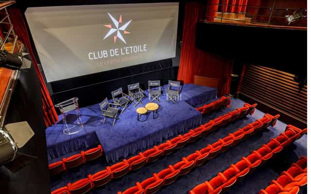 Auditorium at Club de l'Étoile, designed for conferences and presentations, featuring elegant seating.