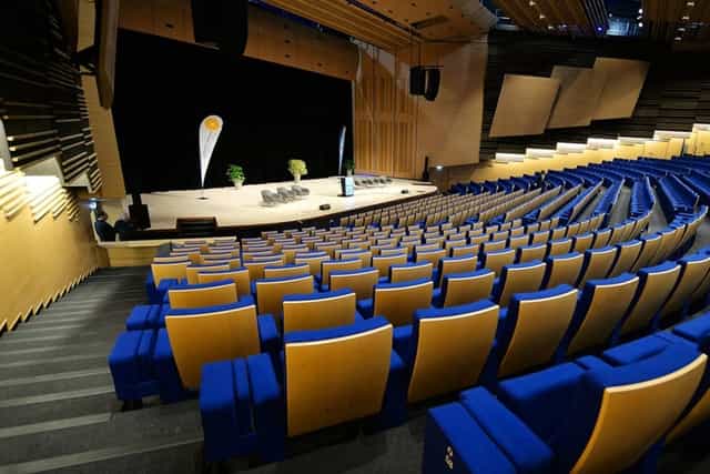 Modern auditorium with tiered seating, perfect for conferences and presentations.