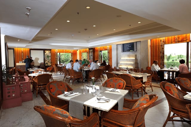 Elegant dining space in The Ashok, perfect for corporate meetings and networking events.