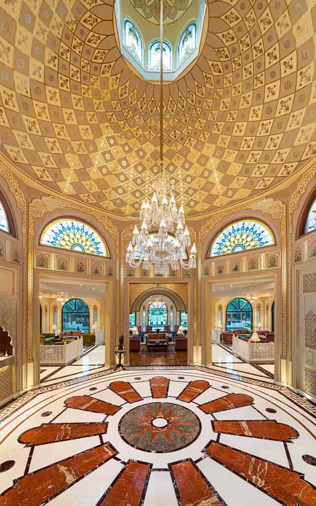 Elegant meeting space at Heritage Village Resorts with grand chandelier, perfect for upscale events.
