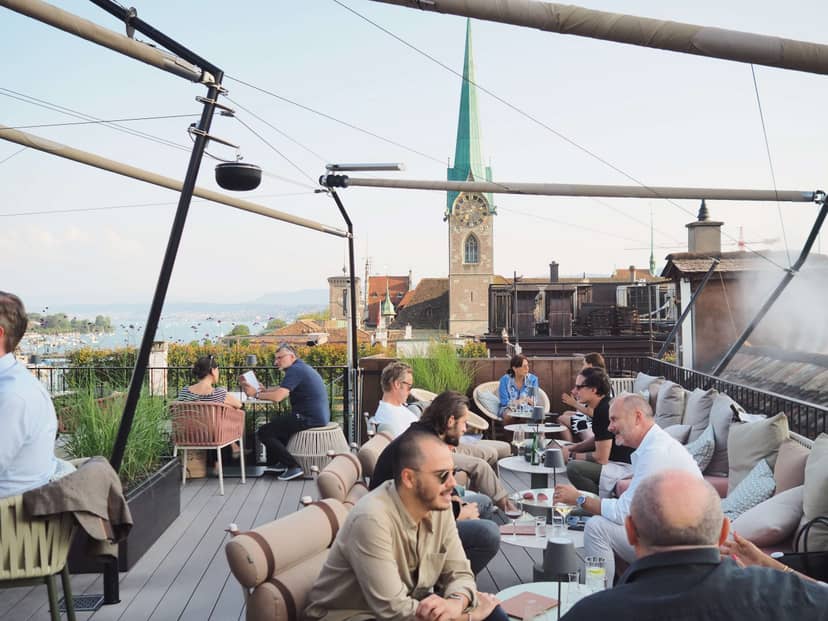 Lively rooftop garden terrace venue with stylish seating for networking events.