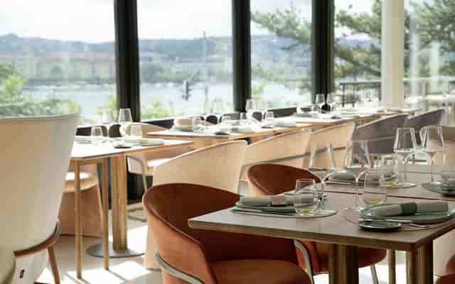 Elegant dining space at LUX Restaurant & Bar for corporate events and private dinners.