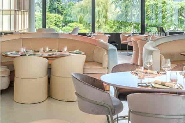 Modern restaurant interior with plush seating, perfect for upscale dining and events.