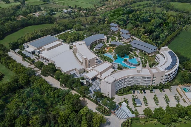 Modern meeting room at Courtyard Aravali Resort, ideal for events and conferences.
