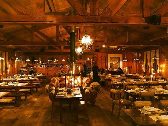 Cozy wooden interior of Baracca Zermatt Kloten restaurant, perfect for intimate gatherings.