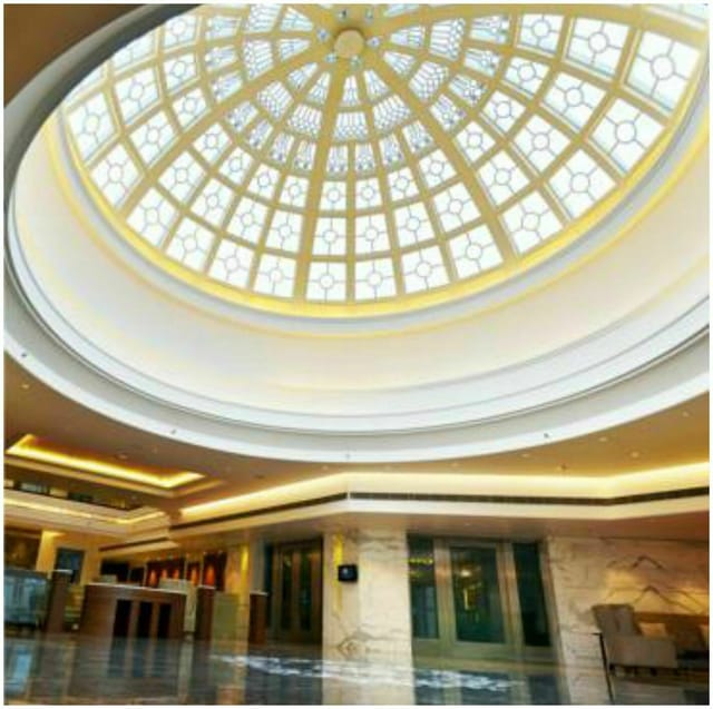 Elegant venue with dome ceiling, ideal for meetings and formal events at The Umrao.