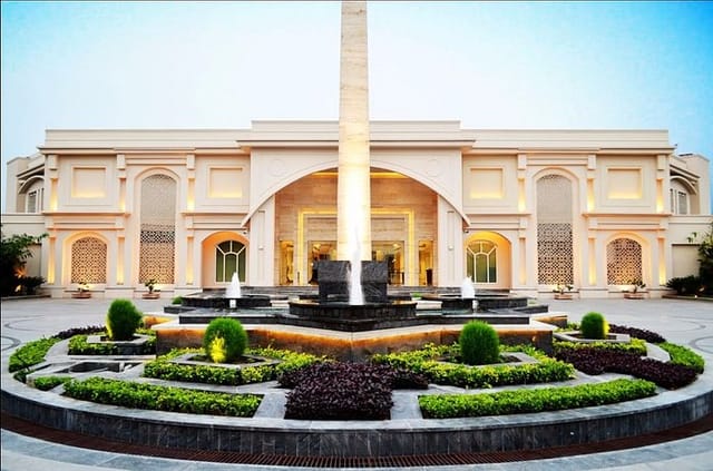 Elegant event venue at The Umrao with stunning gardens and fountain, perfect for weddings.