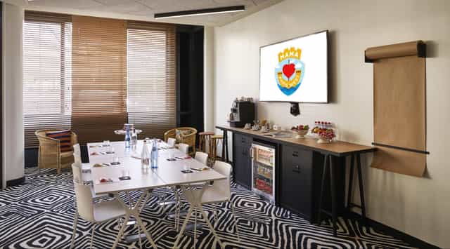 Modern small meeting room at Maison Suger, ideal for collaborative events and presentations.