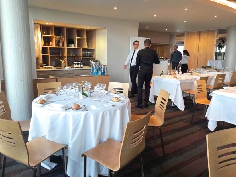 UNESCO Restaurant dining area, round tables and soft lighting for upscale events.