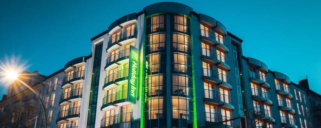 Modern Holiday Inn Berlin, sleek exterior for corporate meetings and social events.