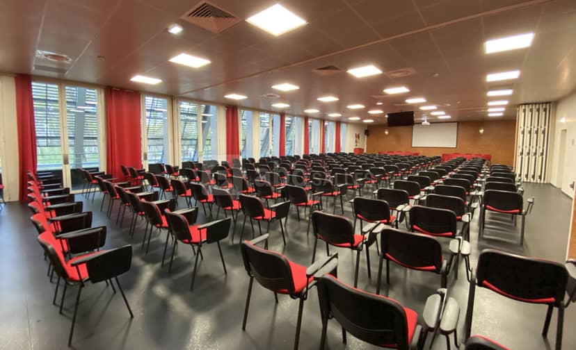 Versatile event space with black chairs for presentations in Palais des Congrès, Perpignan.