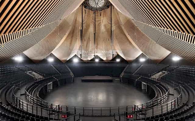 Spacious Tempodrom venue with striking ceiling, perfect for conferences and performances.