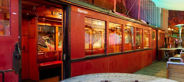 Retro train car event space at SAGE Berlin, ideal for meetings and social gatherings.