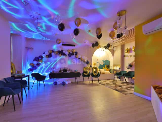 Stylish event space with blue and gold decor for celebrations in Paris 16ème.