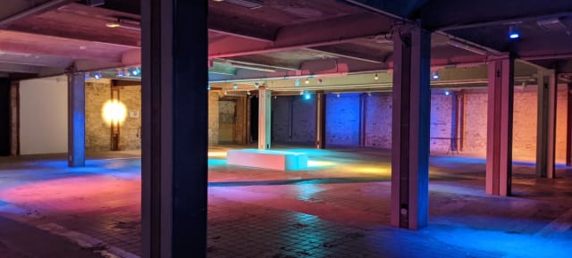 Versatile event space at 5. Etage, Kühlhaus Berlin with exposed brick walls and flexible layout.