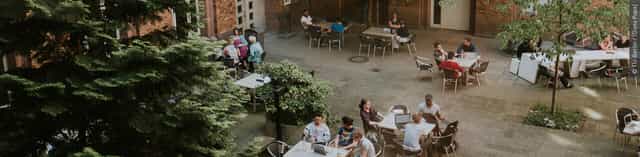 Vibrant outdoor seating at TU Berlin for networking and collaboration events