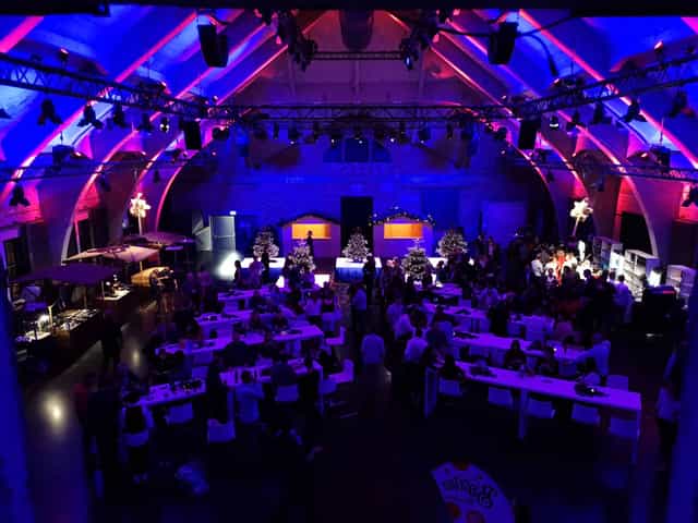 Event space with dramatic lighting for corporate gatherings and celebrations.