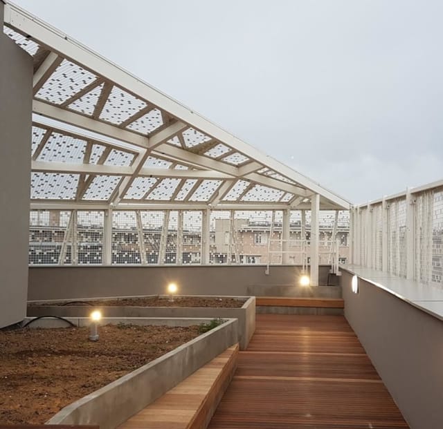 Cresco Auditorium rooftop space, glass-enclosed, ideal for networking events and gatherings.