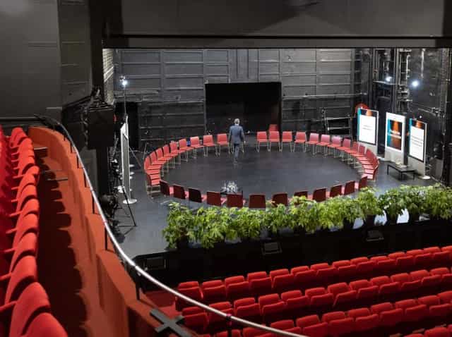 Cresco Auditorium with circular seating, ideal for workshops and panel discussions.