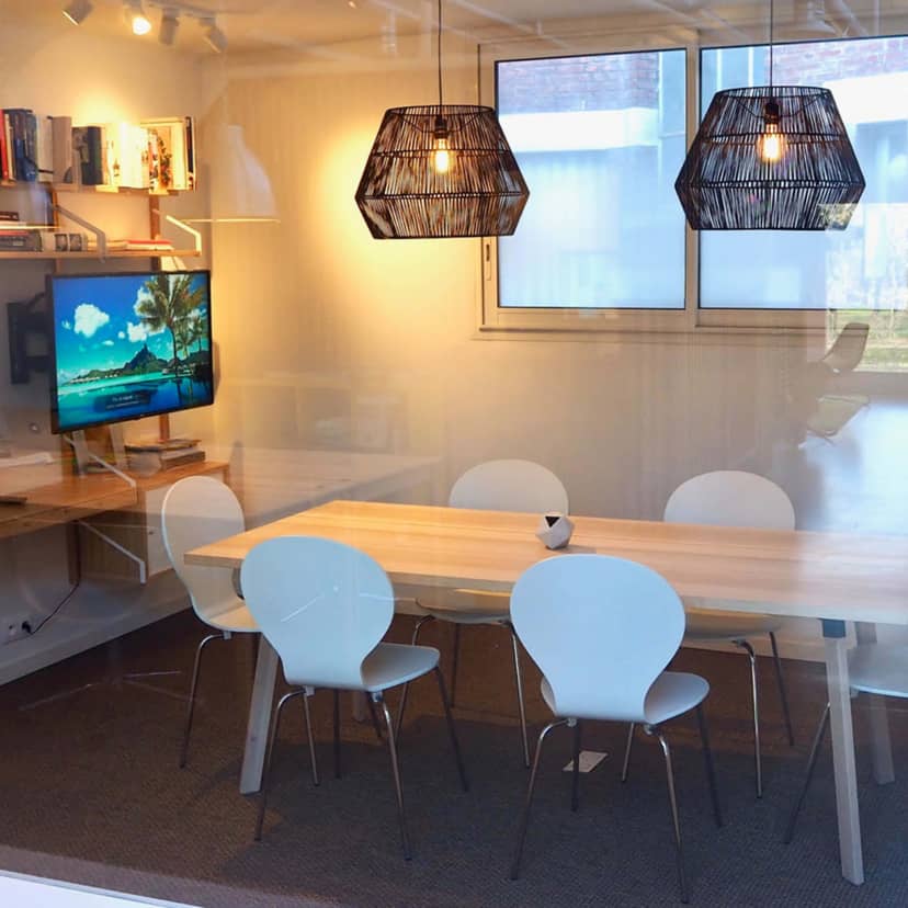 Modern conference room with wooden table for productive meetings in Puteaux, ideal for presentations.