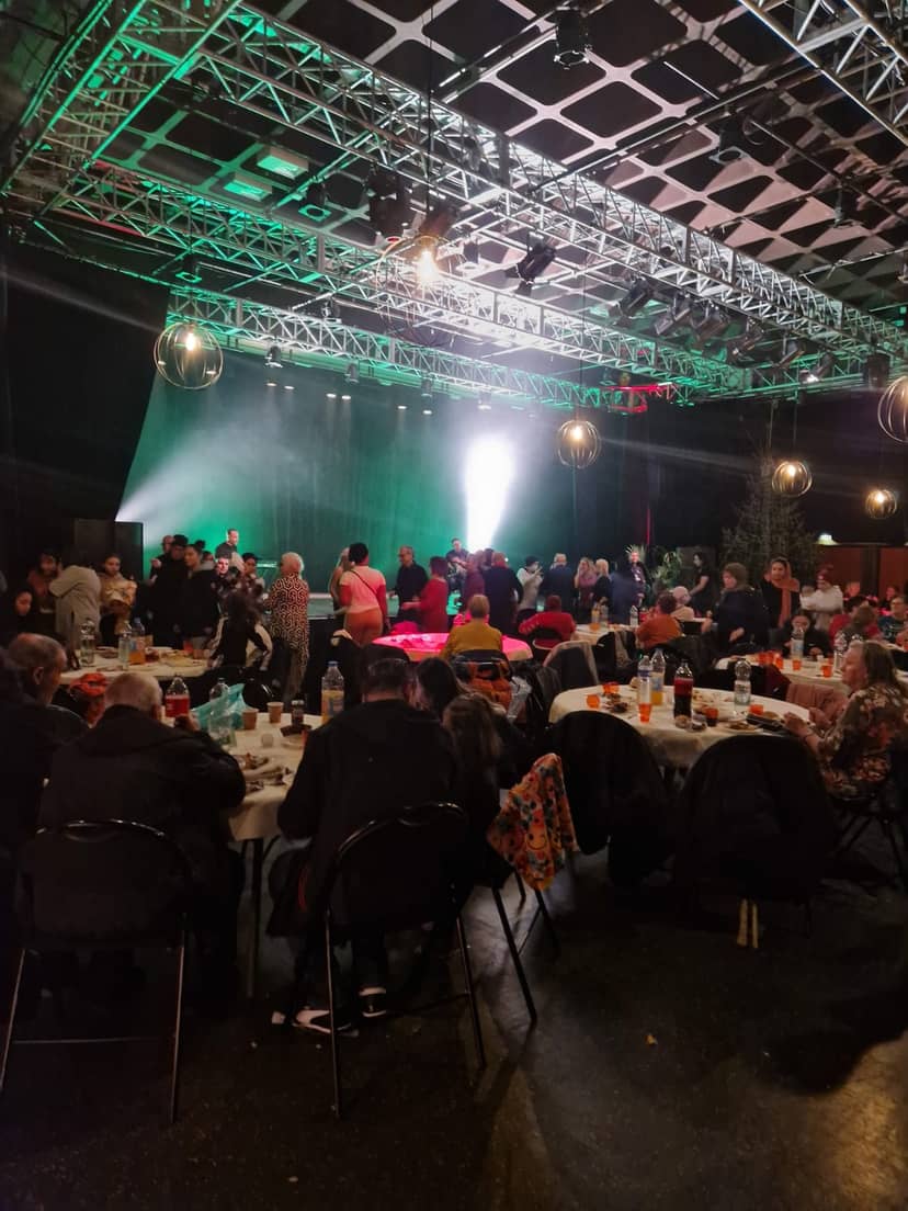 Vibrant event space in Salle Maurice Nilès with dynamic stage for gatherings in Bobigny.