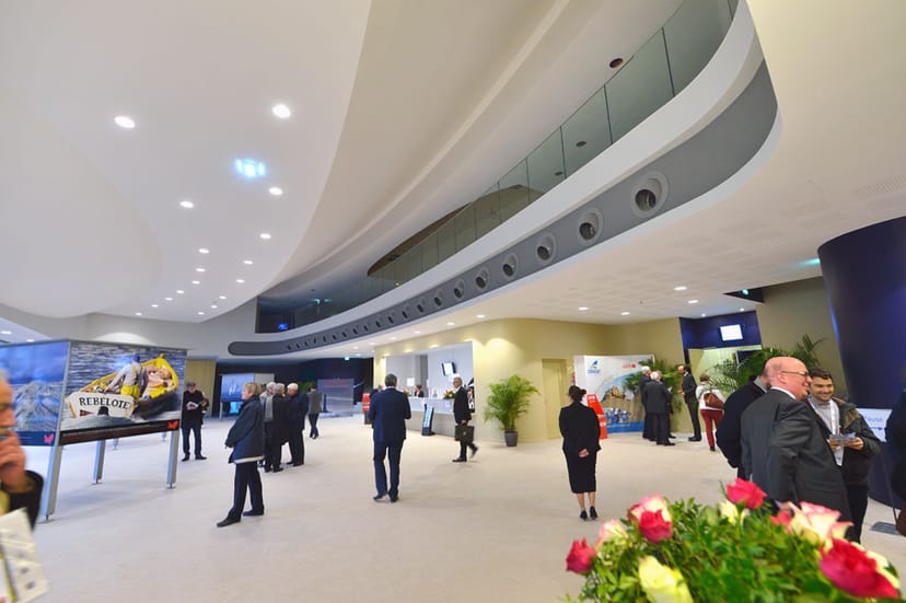 Modern auditorium with elegant curves, ideal for networking events and conferences.