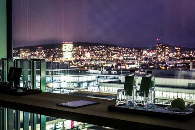 Elegant meeting space at Placid Hotel Zurich with skyline view, perfect for corporate events.