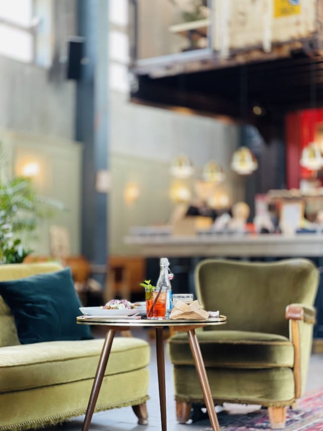 Stylish Kraftwerk bar with comfortable seating for networking and informal gatherings.