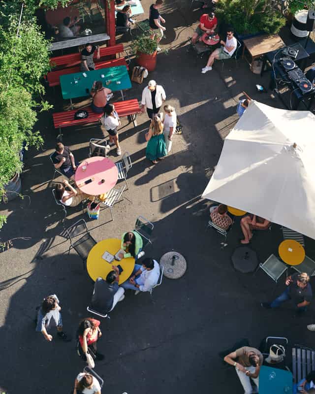 Kraftwerk Terrasse outdoor venue with greenery, perfect for casual networking events.