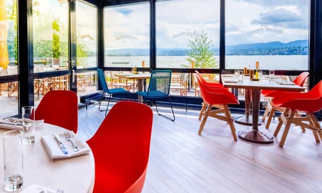 Modern event space in Lake Side with large windows, ideal for meetings and receptions.