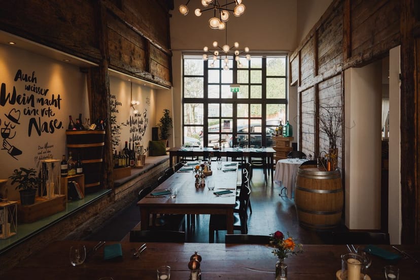 Stylish event space at Restaurant Weinbeiz with rustic decor for gatherings and meetings.