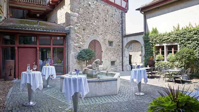 Charming outdoor courtyard at Laufenstube, perfect for networking events or receptions.