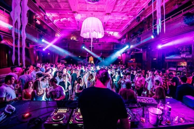 Vibrant event scene with a DJ at Kaufleuten Zürich, perfect for parties and live music.