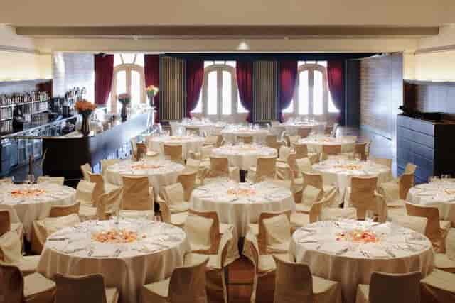 Banquet hall in Kaufleuten Zürich, elegant tables for formal events and celebrations.