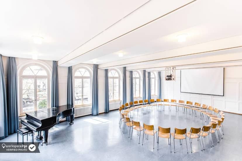 Kalkbreitesaal event space with circular seating, ideal for workshops and meetings.