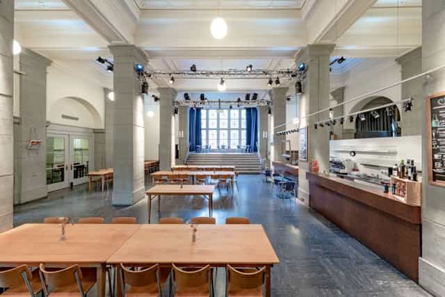 Kalkbreitesaal event venue with large windows, ideal for conferences and gatherings.