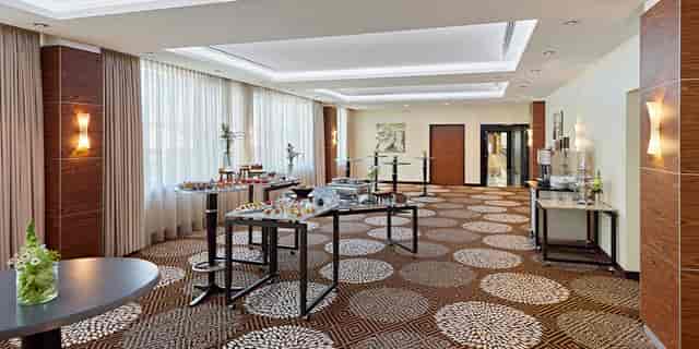 Event space at Salon Schlegel with elegant decor, perfect for networking and receptions.