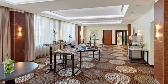 Event space at Salon Schlegel with elegant decor, perfect for networking and receptions.