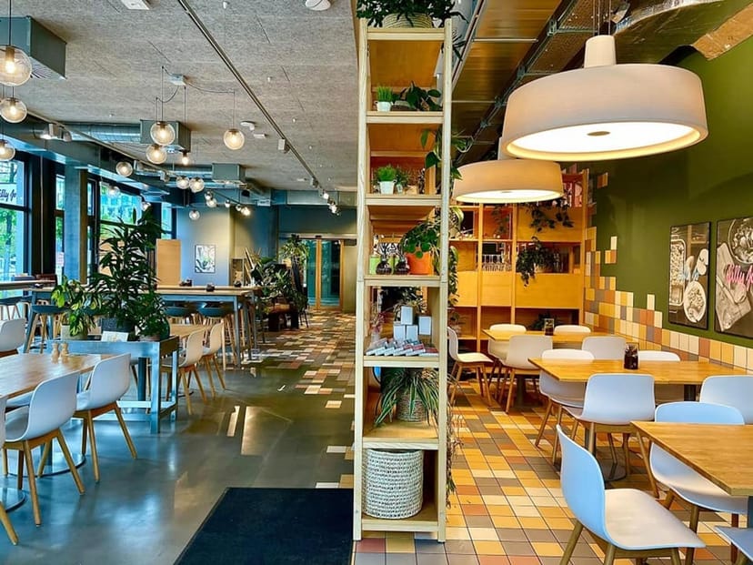 Vibrant event space in Lilly Jo with colorful tiles for casual meetings and workshops.